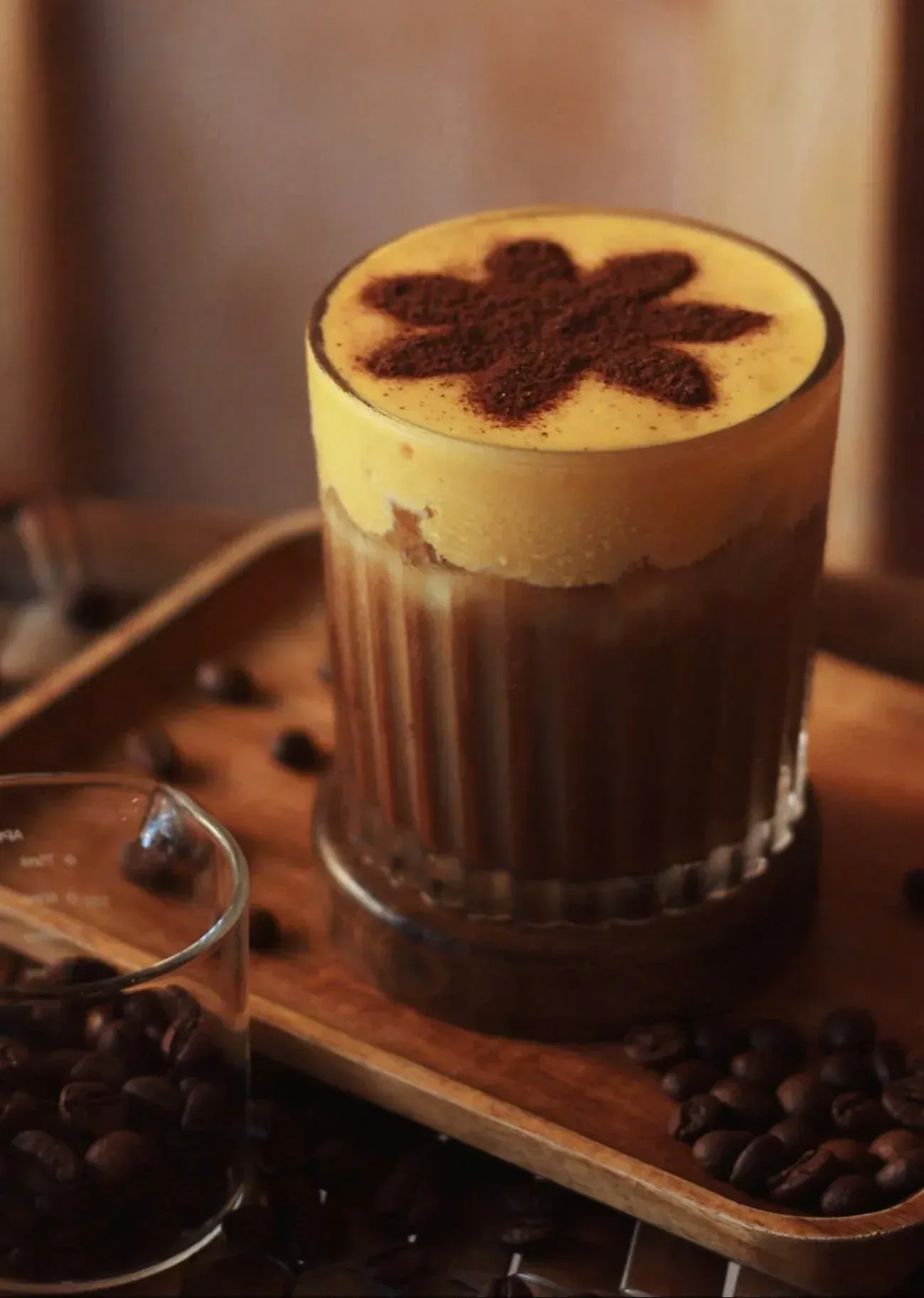 A tray of freshly poured Vietnamese egg coffee, photographed from above.